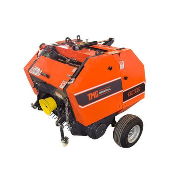TRB50 round hay baler with orange body, two wheels and yellow PTO shaft connector, on white background