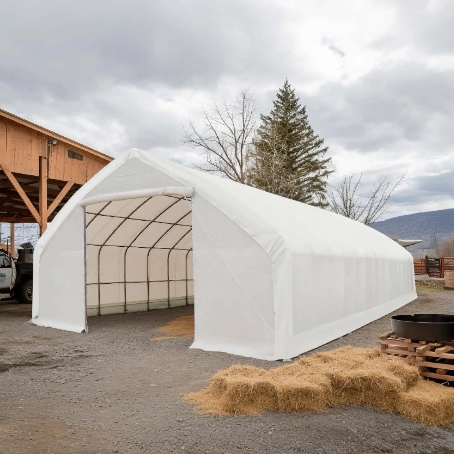 TMG Industrial 30' x 70' Straight Wall Peak Ceiling Storage Shelter with Heavy Duty 17 oz PVC Cover & Drive Through Doors, TMG-ST3070V