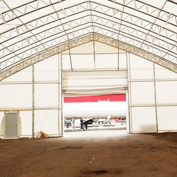 TMG Industrial Pro Series 70' x 100' Dual Truss Storage Shelter with Heavy Duty 32 oz PVC Cover & Drive Through Doors, TMG-DT70100-PRO