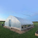 Customer photo: tunnel greenhouse covered with clear poly film, installed on a concrete base in an open field