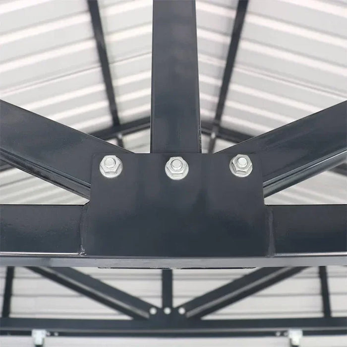 Close-up of bolted truss connection inside metal garage shed roof.