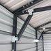 Interior sidewall brace and bracket connections inside metal garage shed.