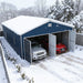 Aerial snowy view showing open bays and parked cars in metal garage shed