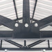 Close-up roof truss connection with bolts inside metal garage shed